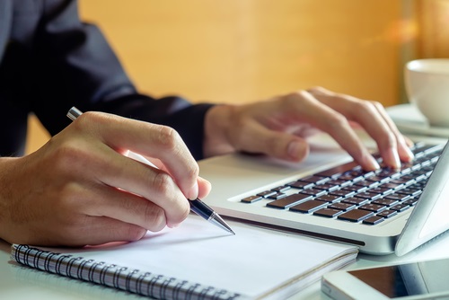 writing-report-at-keyboard